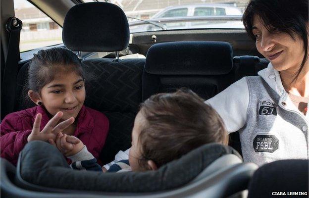 Zaneta, daughter Andrea, nine, and baby grandson Roman in the car