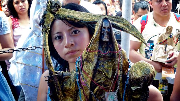 Devotee prays to Santa Muerte