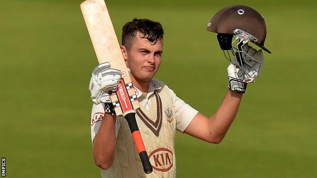 Dominic Sibley celebrates reaching his century for Surrey