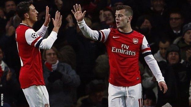 Mesut Ozil (left) with Jack Wilshere