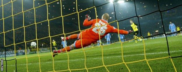 Borussia Dortmund forward Marco Reus opens the scoring against Napoli