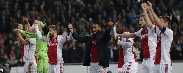 The Ajax players celebrate their victory against Barcelona