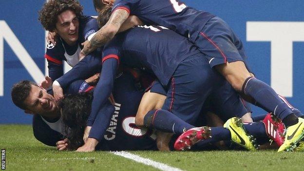 Paris St-Germain's Edinson Cavani celebrates with team-mates after scoring the second goal for the team during their Champions League