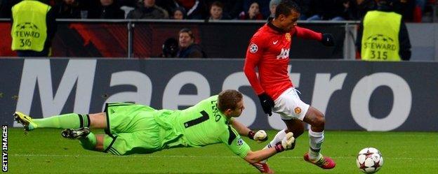 Nani of Manchester United rounds Bernd Leno of Bayer Leverkusen to score their fifth goal