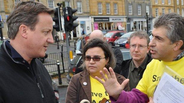 David Cameron in Chipping Norton being confronted by ACE Centre protesters