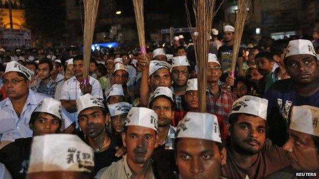 AAP supporters campaigning with brooms in Delhi