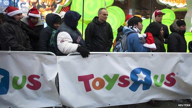 People line up outside a Toys'R'Us store in Times Square before their Black Friday Sale in New York November 28, 2013.