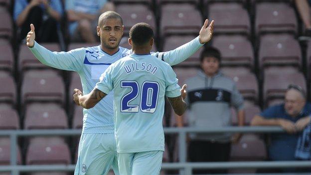 Leon Clake and Callum Wilson celebrate at Sixfields