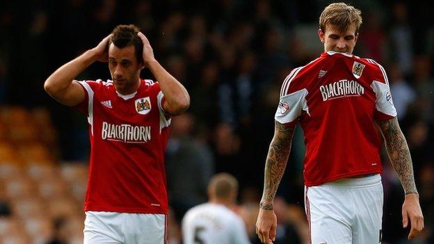 Bristol City's Sam Baldock and Aden Flint walk off the pitch