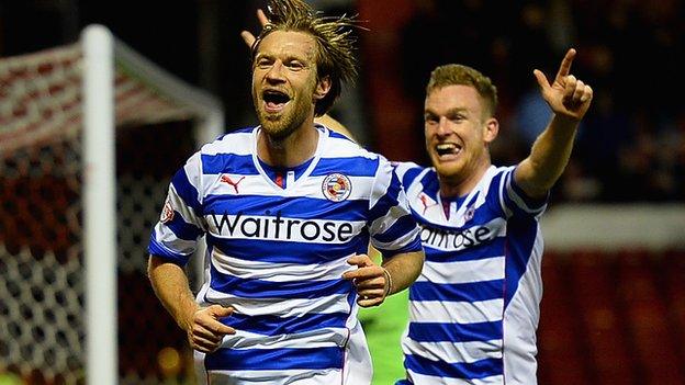 Reading defender Kaspars Gorkss celebrates his goal