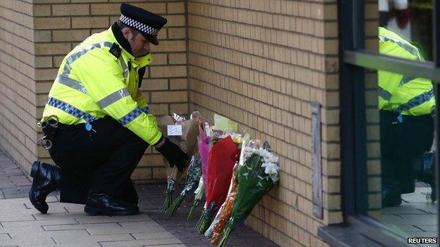 Flowers laid near the scene of the helicopter crash