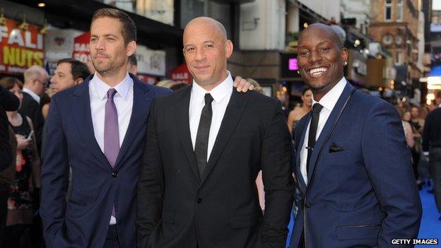 Paul Walker and Vin Diesel stand with Tyrese Gibson at premiere of Fast & Furious 6