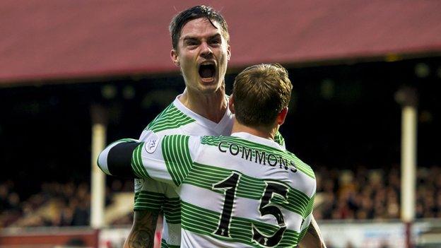 Mikael Lustig celebrates with Kris Commons