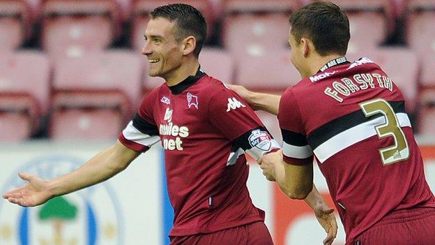 Craig Bryson (left) celebrates his opener with Craig Forsyth