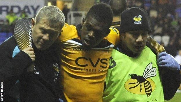 Christian Wade is helped off the pitch after injuring his ankle