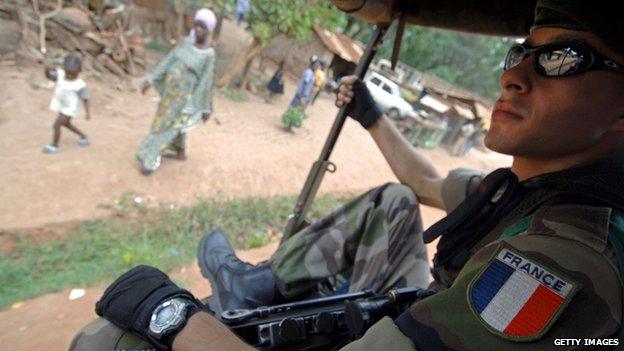 A French soldier sits in a mobile patrol in Bangui, Central African Republic, in this file photo from July 2007.