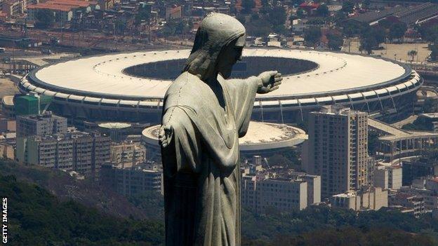 The Maracana stadium, with the Christ the Redeemer statue in the foreground