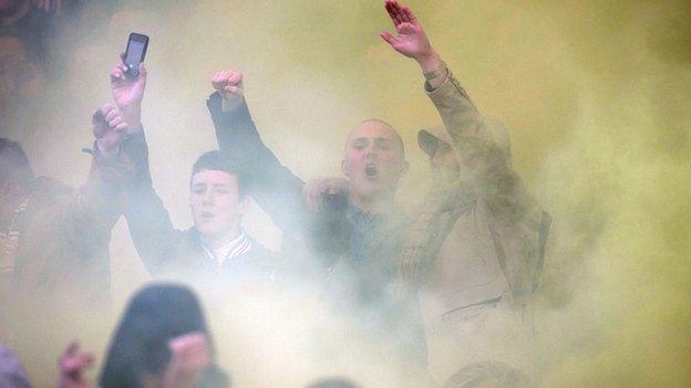 Fans obscured by a flare at New Douglas Park