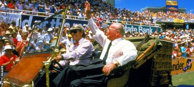 Sir Donald Bradman waves to the crowd during a lap of honour at the Bicentennial Test in 1988