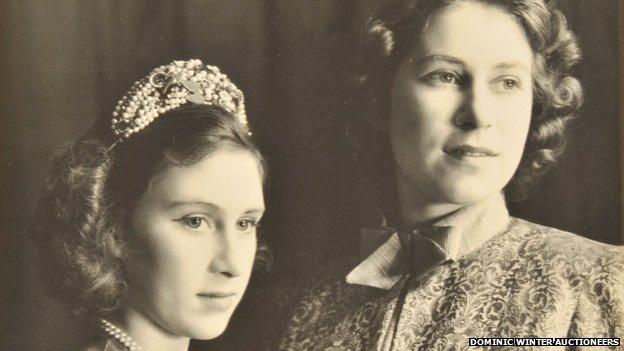 The Queen (right) and Princess Margaret in pantomime in 1942