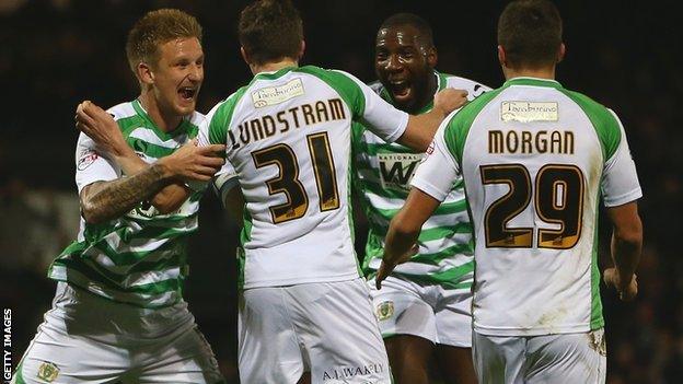 Yeovil players celebrate beating Blackpool