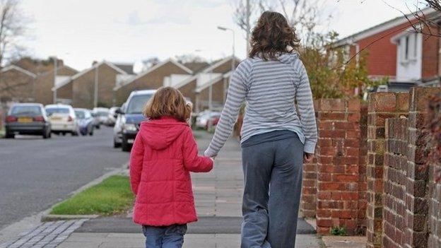 A family walking down the street