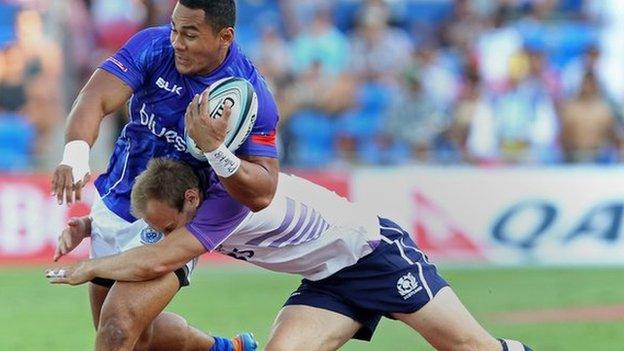 Samoa's Meki Magele is tackled by Scotland's Andrew Turnbull