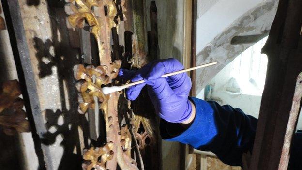 Work on the altar screen in St Cadoc's Church, Llancarfan