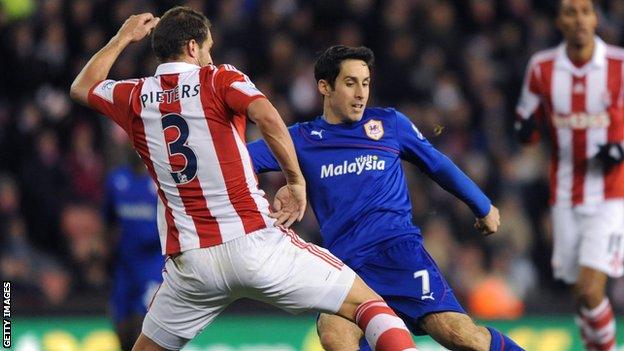 Cardiff's Peter Whittingham has a shot blocked by Erik Pieters