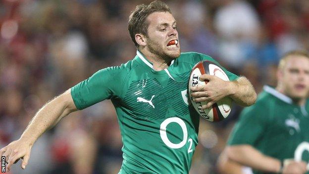 Dave Cave runs in to score a try for Ireland against Canada in June