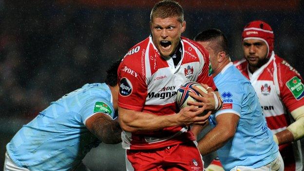 Gloucester"s James Hudson is tackled during the Heineken Cup