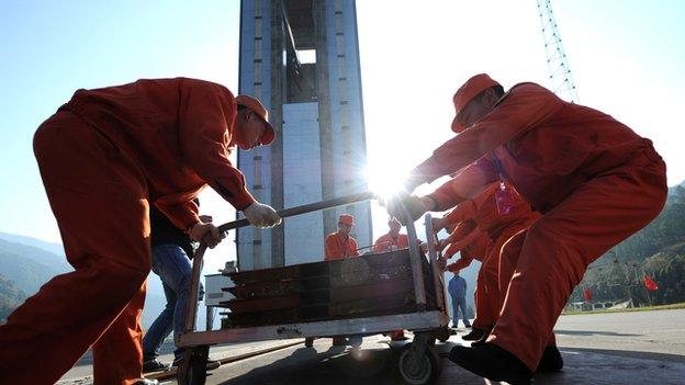 Workers make final preparations for China's first lunar rover mission. Soon there could be more UK involvement in Chinese space missions