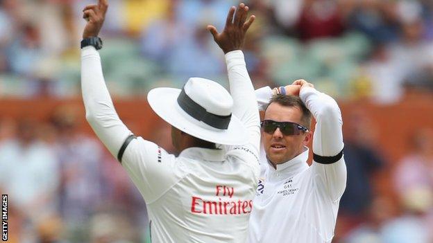 Graeme Swann is frustrated as the umpire signals six