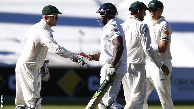 Brad Haddin shakes hands with Michael Carberry after day two