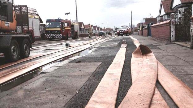 Rhyl flood clean-up scene