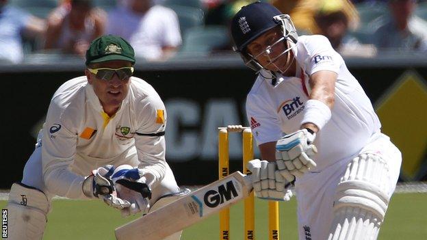 Joe Root plays a slog-sweep shot from which he was caught