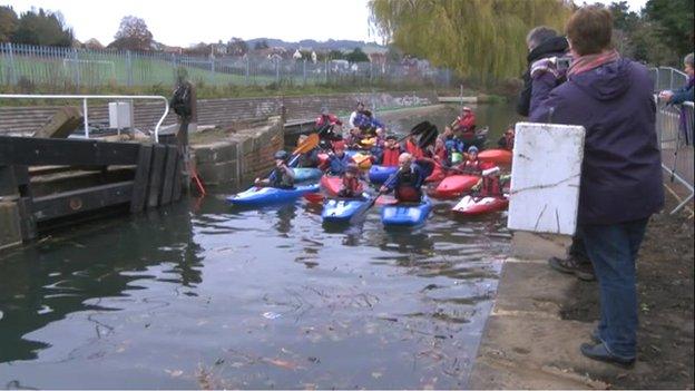 A group of kayakers move into Dudbridge Upper Lock, Stroud