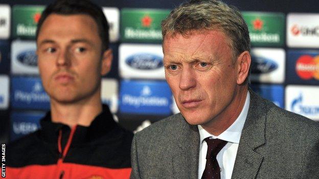 Manchester United defender Jonny Evans (left) and manager David Moyes