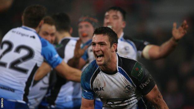 Dave McSharry celebrates Connacht's success as other team-mates embrace in the background