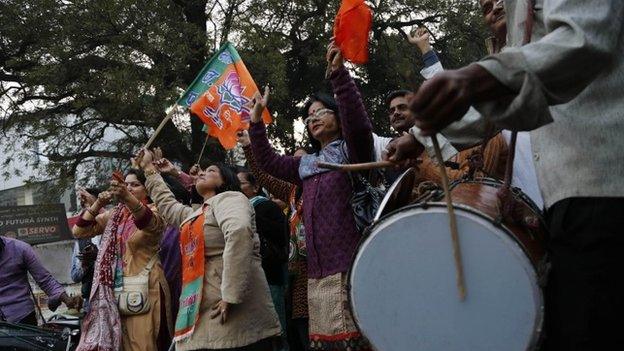 India’s main opposition Bharatiya Janata Party (BJP) supporters celebrate the party’s victory in various state Assembly elections in Allahabad, India, Sunday, Dec. 8, 2013