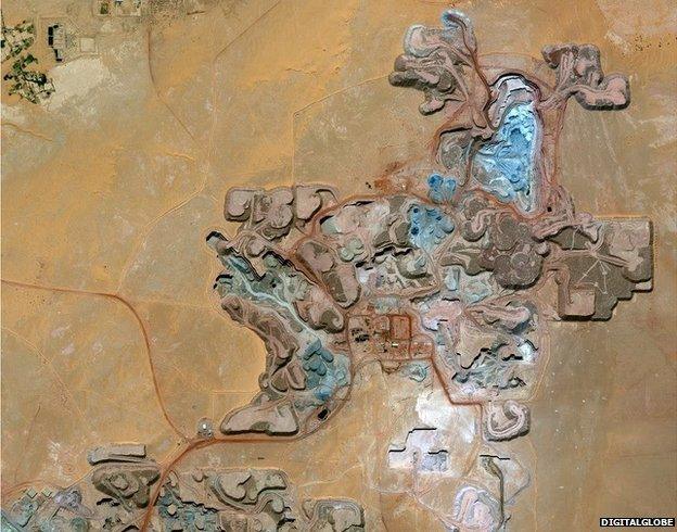 Resembling the patterning in a picture by Gustav Klimt, this image shows the Arlit uranium mine in Niger