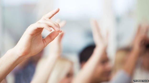 Hands raised in class