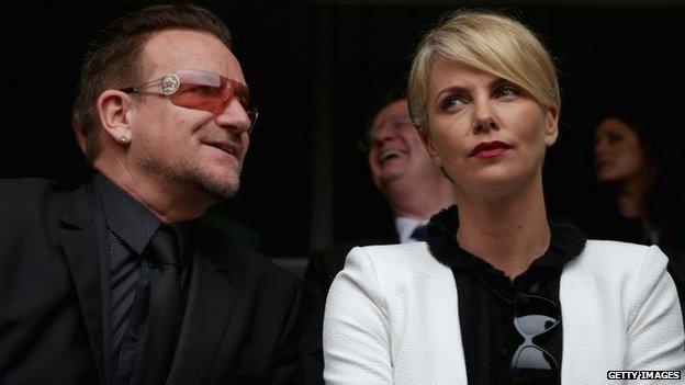 Bono and Charlize Theron attend the ceremony, 10 Dec