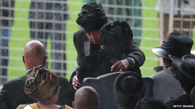 Ex-wife Winnie Madikizela-Mandela hugs widow Graca Machel, 10 Dec