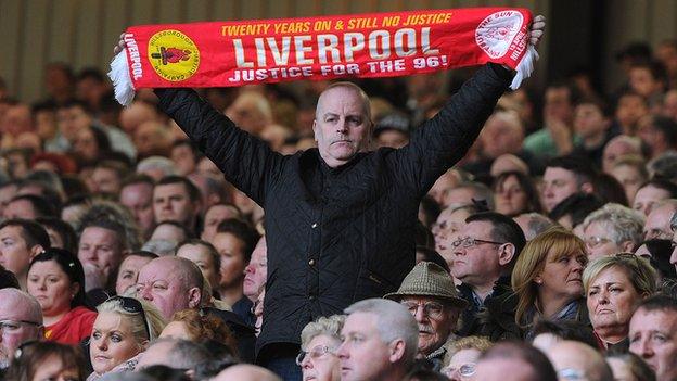 A Liverpool fan at Anfield marking the 24th anniversary of the Hillsborough disaster