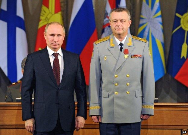 Russian President Vladimir Putin (left) with the Commander of the Russian Military Air and Space Defence Forces, Alexander Golovko, in Moscow, 10 December