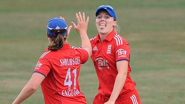 Heather Knight of England celebrates catching Jodie Fields of Australia with team mate Anya Shrubsole (left)