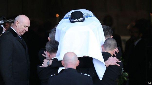 Coffin carried into cathedral