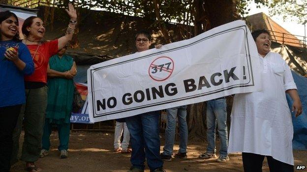 Activists hold a banner during a protest against the Supreme Court ruling reinstating a ban on gay sex, in Mumbai on December 11, 2013.