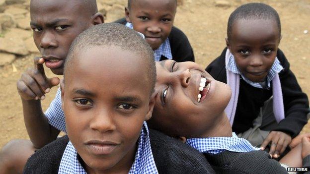 Children pose for a photograph outside their classrooms in Nairobi, Kenya - June 2013